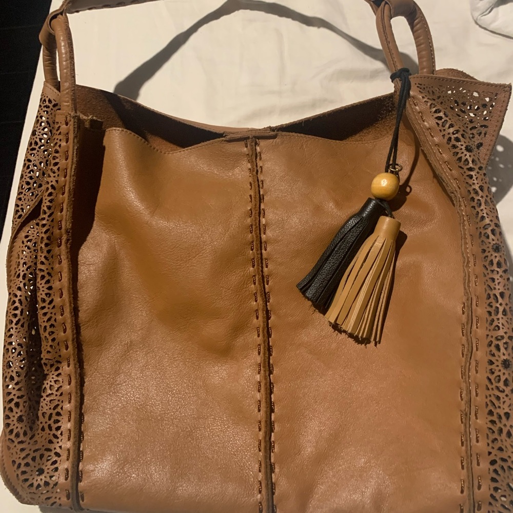 The Sak genuine leather handbag. Very spacious and soft leather, like brand new